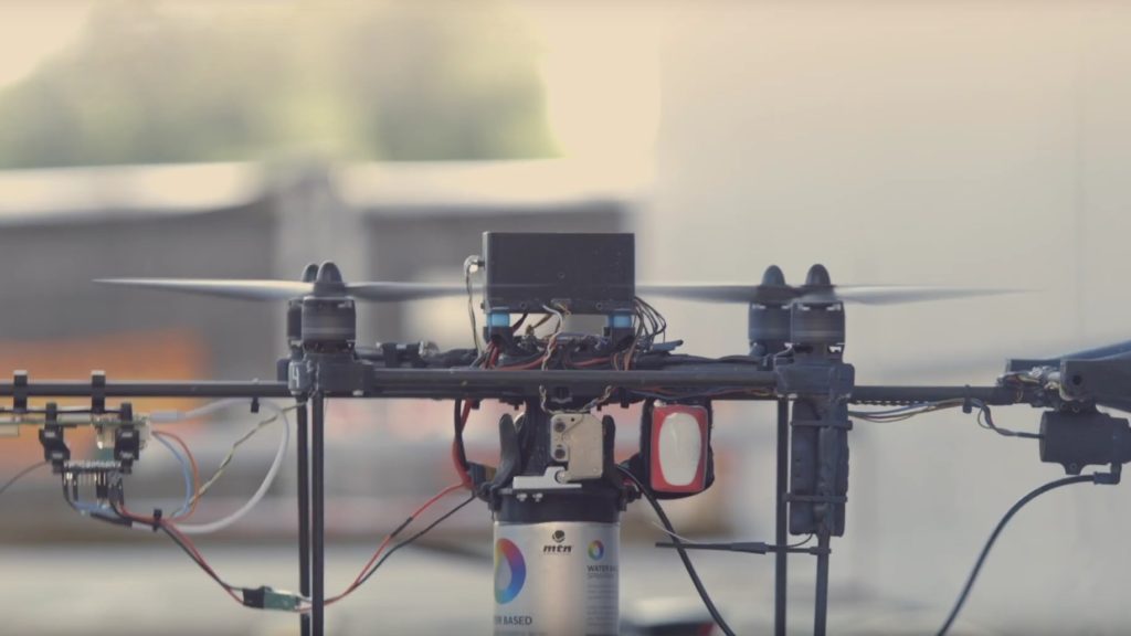 This drone swarm spray painted a jumbo-size graffiti mural